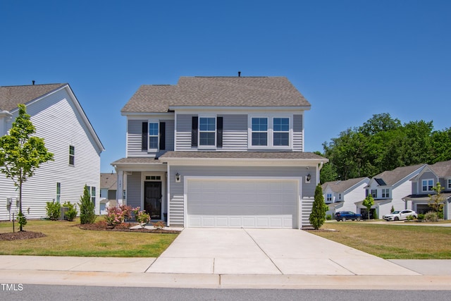 147 Antler Steel Dr, Clayton, NC 27527 - traditional-style house with a shingled roof, an attached garage, driveway, and a front lawn