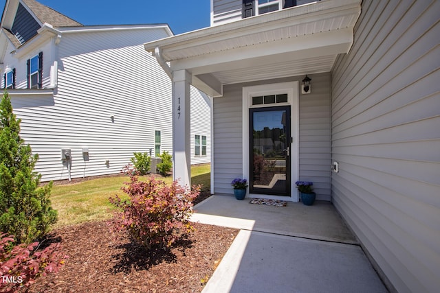 147 Antler Steel Dr, Clayton, NC 27527 - doorway to property featuring covered porch