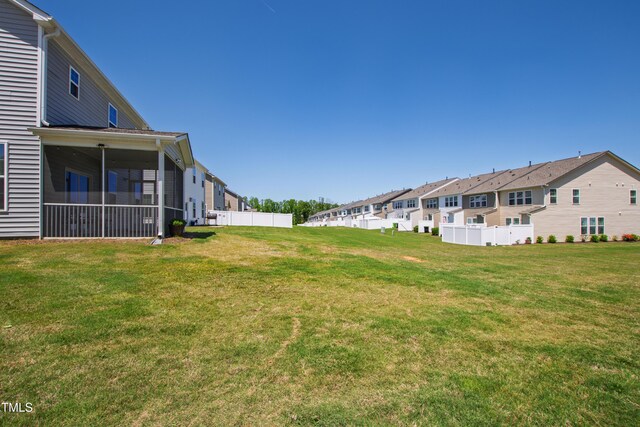 147 Antler Steel Dr, Clayton, NC 27527 - view of yard featuring fence, a residential view, and a sunroom