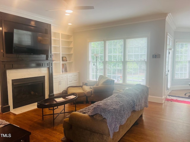 8729 Valentine Ct, Raleigh, NC 27613 - living room with ornamental molding, ceiling fan, a fireplace, wood finished floors, and plenty of natural light