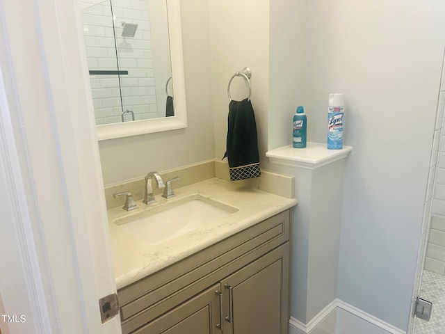 8729 Valentine Ct, Raleigh, NC 27613 - bathroom featuring vanity and a tile shower