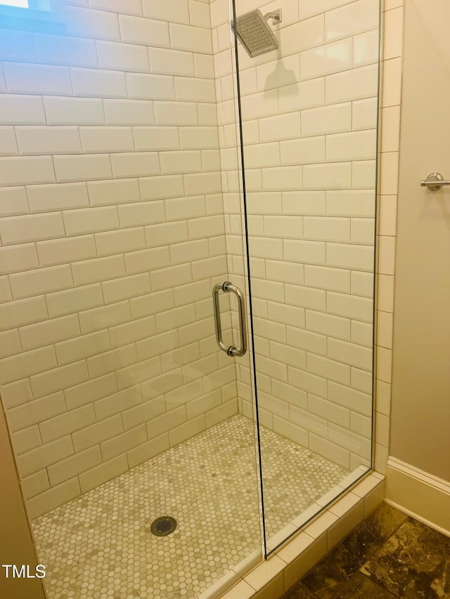 8729 Valentine Ct, Raleigh, NC 27613 - full bathroom featuring a stall shower and baseboards