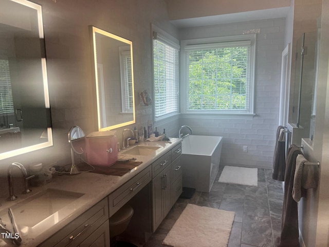 8729 Valentine Ct, Raleigh, NC 27613 - full bath with a tub to relax in, double vanity, and a stall shower