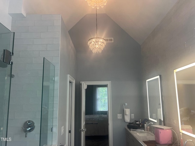 8729 Valentine Ct, Raleigh, NC 27613 - full bath with a chandelier, ensuite bath, tiled shower, double vanity, and high vaulted ceiling
