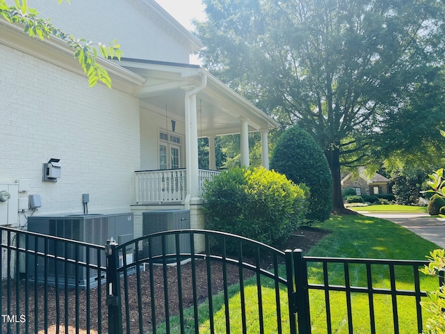 8729 Valentine Ct, Raleigh, NC 27613 - view of side of property featuring cooling unit, brick siding, and a porch