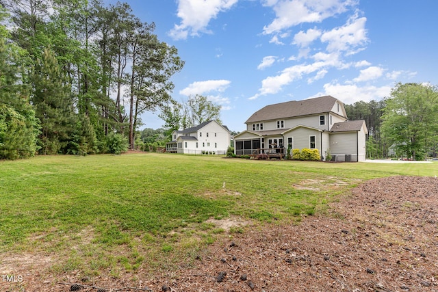 view of yard with a sunroom
