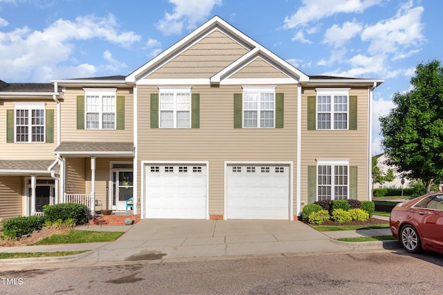view of front of property featuring a garage and concrete driveway