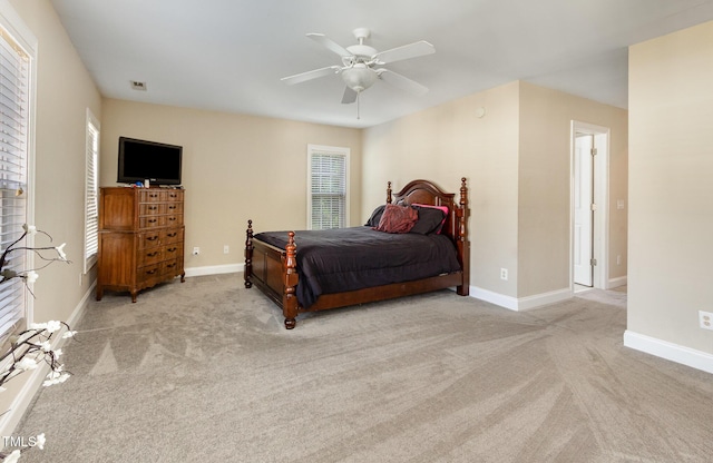 bedroom featuring baseboards, carpet flooring, and a ceiling fan