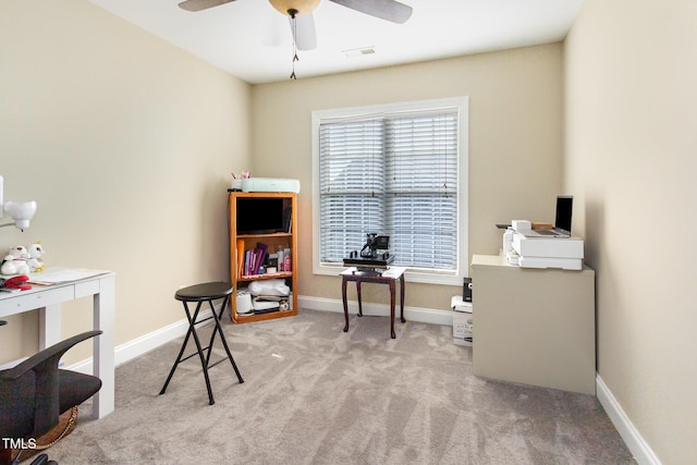 office featuring visible vents, carpet flooring, baseboards, and ceiling fan