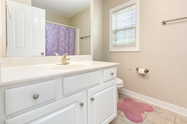 full bath featuring vanity, toilet, baseboards, tile patterned floors, and a shower with curtain