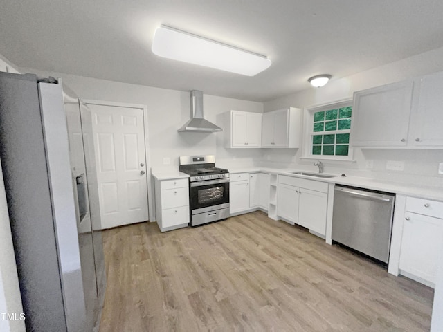517 Hidden Cellars Dr, Holly Springs, NC 27540 - kitchen with light wood-type flooring, a sink, wall chimney range hood, and stainless steel appliances