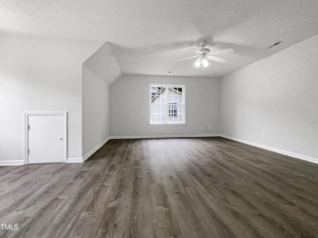 517 Hidden Cellars Dr, Holly Springs, NC 27540 - bonus room featuring ceiling fan, a textured ceiling, baseboards, dark wood-type flooring, and visible vents