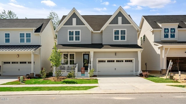 1733 Birdhaven Ln Lot 2217, Wendell, NC 27591 - craftsman house with a garage, a porch, board and batten siding, and concrete driveway