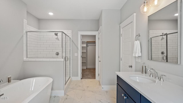 1733 Birdhaven Ln Lot 2217, Wendell, NC 27591 - bathroom with a soaking tub, a stall shower, marble look tile flooring, vanity, and recessed lighting