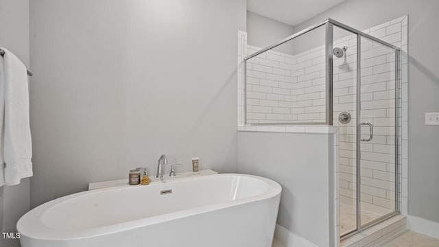 1733 Birdhaven Ln Lot 2217, Wendell, NC 27591 - bathroom with a freestanding bath and a stall shower