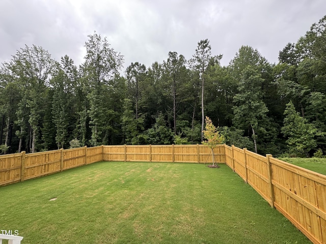 1733 Birdhaven Ln Lot 2217, Wendell, NC 27591 - fenced backyard with a wooded view