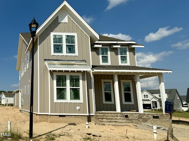 1720 Bright Lantern Way, Wendell, NC 27591 - rear view of property featuring board and batten siding, crawl space, a shingled roof, and covered porch