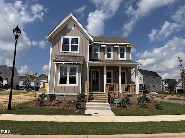 1720 Bright Lantern Way, Wendell, NC 27591 - view of front of home with a porch, board and batten siding, a residential view, and a front yard