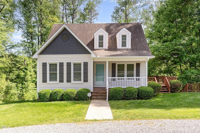 200 Weybossett Rd, Henderson, NC 27537 - cape cod-style house with a porch, a shingled roof, and a front lawn