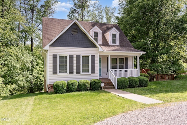200 Weybossett Rd, Henderson, NC 27537 - new england style home featuring roof with shingles, covered porch, and a front yard