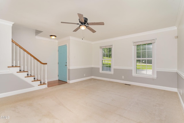 200 Weybossett Rd, Henderson, NC 27537 - unfurnished room with crown molding, carpet, stairs, a ceiling fan, and baseboards