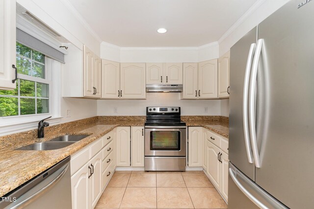 200 Weybossett Rd, Henderson, NC 27537 - kitchen with crown molding, a sink, light tile patterned floors, under cabinet range hood, and stainless steel appliances