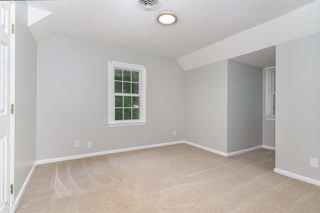 200 Weybossett Rd, Henderson, NC 27537 - spare room featuring baseboards, visible vents, light colored carpet, and lofted ceiling