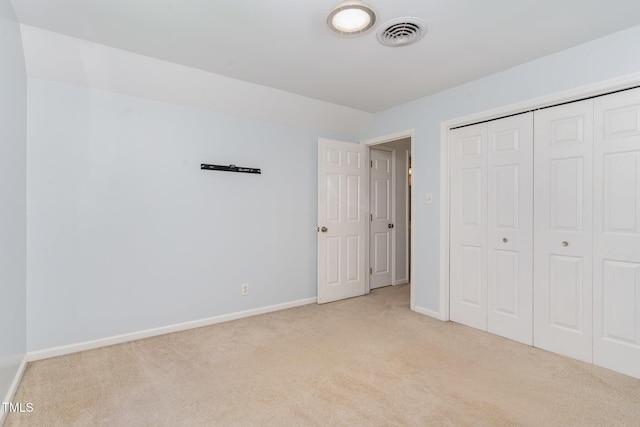 200 Weybossett Rd, Henderson, NC 27537 - unfurnished bedroom featuring carpet floors, baseboards, visible vents, and a closet