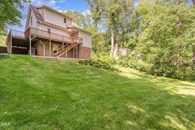 200 Weybossett Rd, Henderson, NC 27537 - back of property featuring central air condition unit, a yard, stairway, and a deck