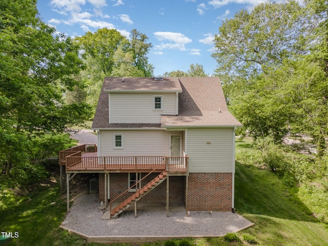 200 Weybossett Rd, Henderson, NC 27537 - rear view of property featuring stairway, a deck, a patio area, and a lawn