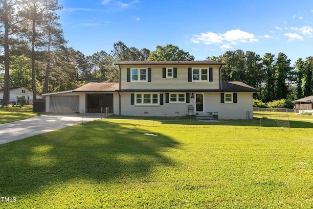 colonial-style house with concrete driveway, a front yard, an attached garage, and fence