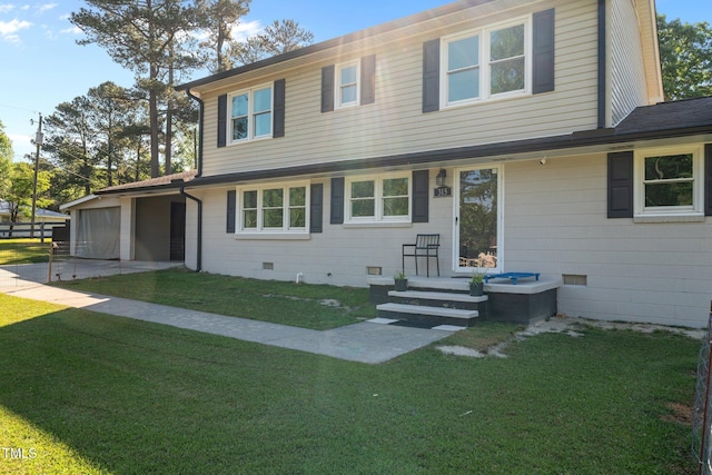 view of front of house with a front lawn, crawl space, driveway, and an attached garage