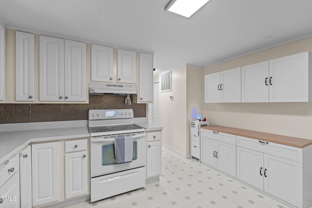 kitchen featuring under cabinet range hood, white electric range, light countertops, and white cabinetry
