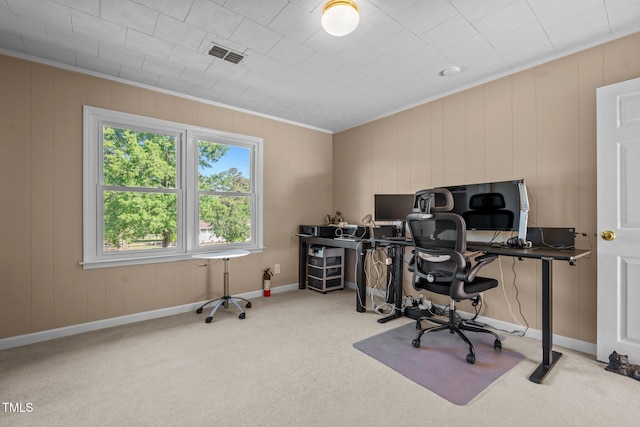 home office featuring baseboards, ornamental molding, visible vents, and carpet