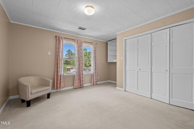 unfurnished room featuring carpet floors, baseboards, and visible vents