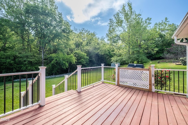 wooden terrace with a lawn