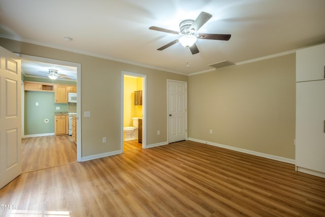unfurnished bedroom with connected bathroom, light wood-style floors, baseboards, visible vents, and ornamental molding