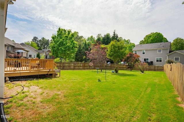 view of yard with a deck and a residential view