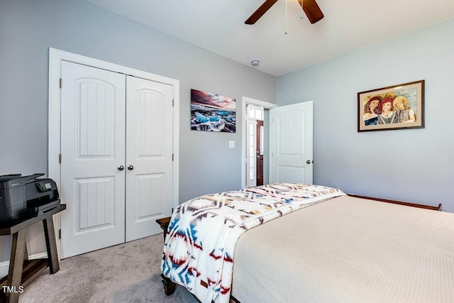 bedroom with light carpet, a closet, and ceiling fan