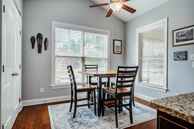 dining area with plenty of natural light, lofted ceiling, a ceiling fan, and baseboards