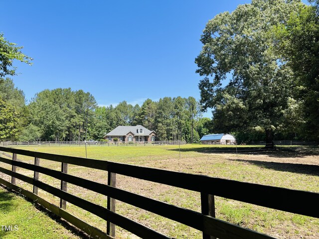 108 Cedarwood Dr, Louisburg, NC 27549 - view of yard with a view of countryside, an enclosed riding area, and a forest view