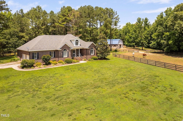 108 Cedarwood Dr, Louisburg, NC 27549 - cape cod home featuring brick siding, an attached garage, and driveway