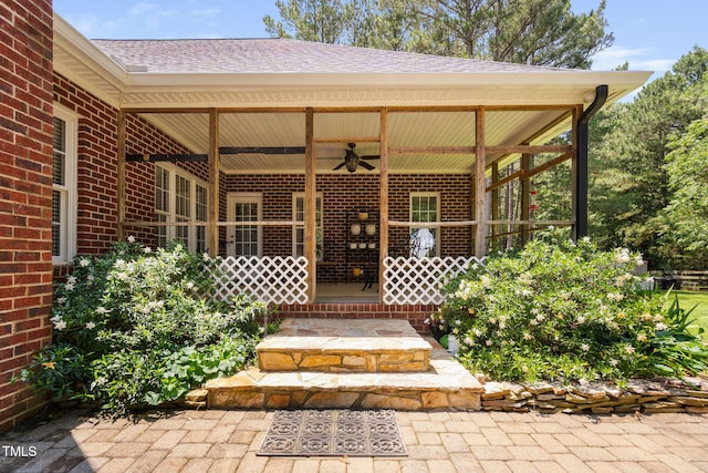 108 Cedarwood Dr, Louisburg, NC 27549 - view of exterior entry with ceiling fan, brick siding, and a shingled roof