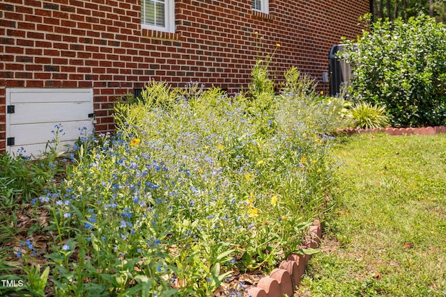 108 Cedarwood Dr, Louisburg, NC 27549 - exterior view of brick siding and central air condition unit
