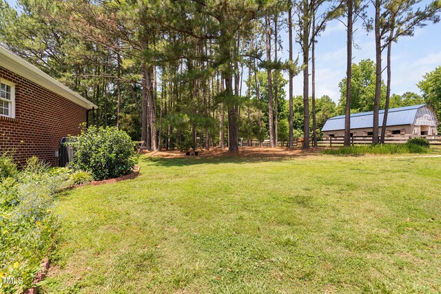 108 Cedarwood Dr, Louisburg, NC 27549 - view of yard with an outdoor structure