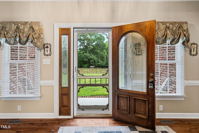 108 Cedarwood Dr, Louisburg, NC 27549 - entryway featuring plenty of natural light, wood finished floors, and baseboards