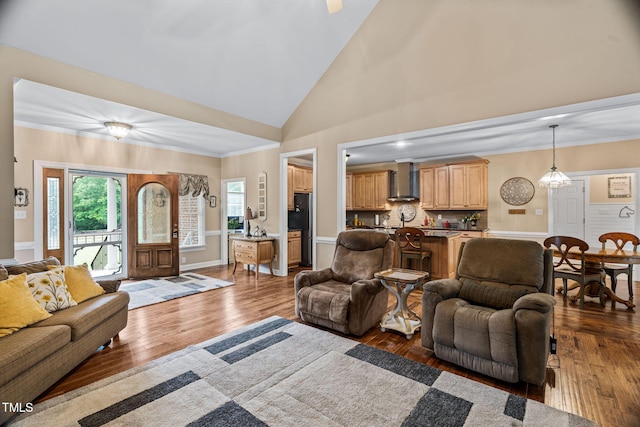 108 Cedarwood Dr, Louisburg, NC 27549 - living area featuring dark wood-style floors, high vaulted ceiling, baseboards, and crown molding