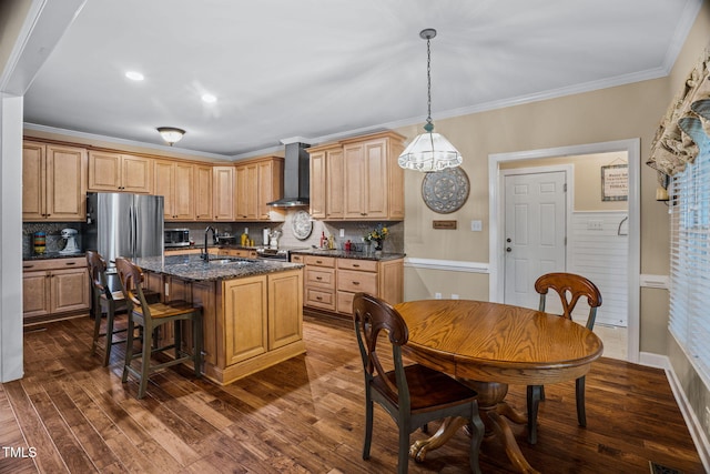 108 Cedarwood Dr, Louisburg, NC 27549 - kitchen with wall chimney range hood, a sink, ornamental molding, a kitchen breakfast bar, and dark wood-style floors