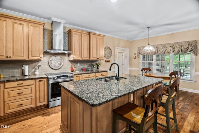 108 Cedarwood Dr, Louisburg, NC 27549 - kitchen featuring wall chimney range hood, electric stove, a sink, hardwood / wood-style flooring, and a kitchen bar