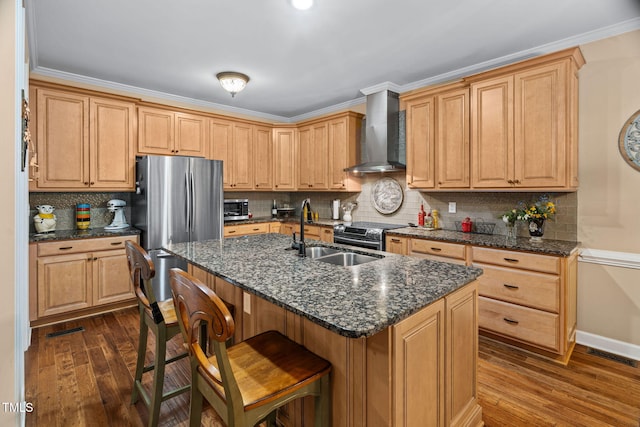 108 Cedarwood Dr, Louisburg, NC 27549 - kitchen featuring wall chimney exhaust hood, a sink, dark wood finished floors, a breakfast bar area, and decorative backsplash